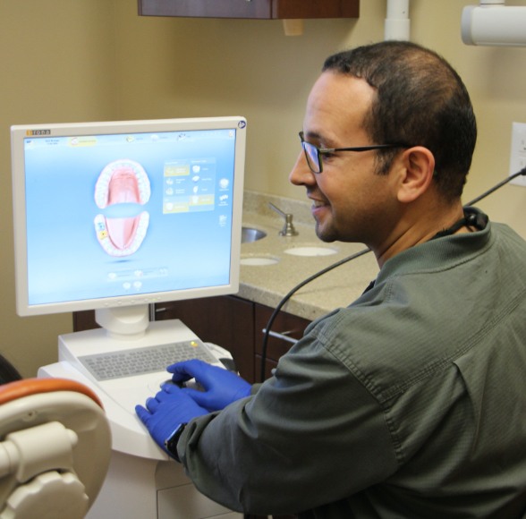 Dentist examining digital impressions