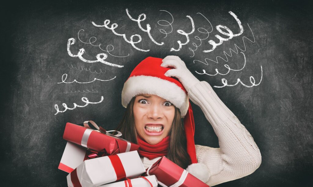 A woman grinding her teeth due to holiday stress